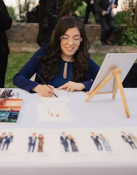 Mimí Palacios pintando retratos rápidos en acuarela