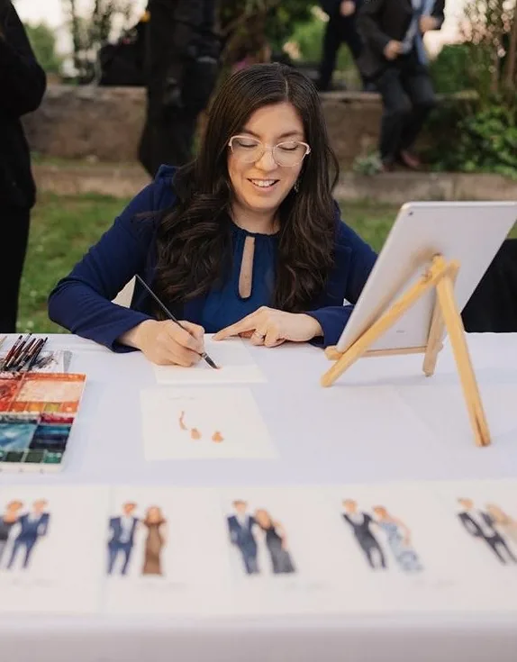 Mimí Palacios pintando retratos rápidos en acuarela